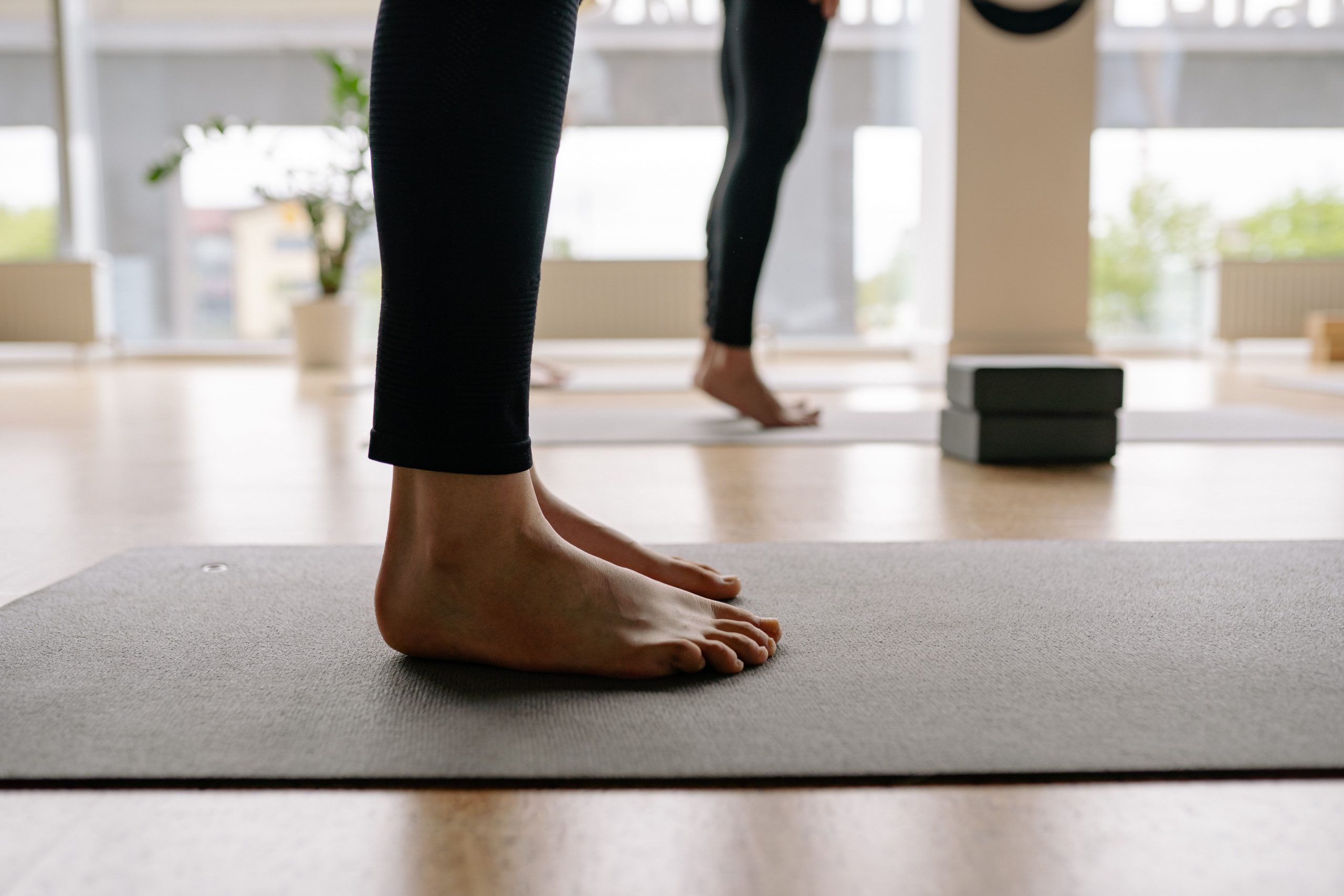 Home Standing on a yoga mat